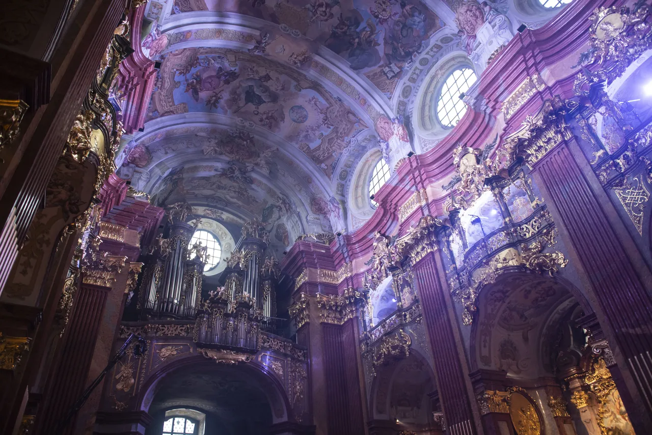 Ceiling frescoes and organ of the abbey church of Melk in violet light