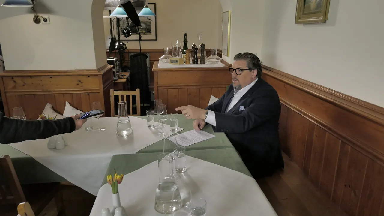Michael Schade at a table in the Gasthaus Grünauer