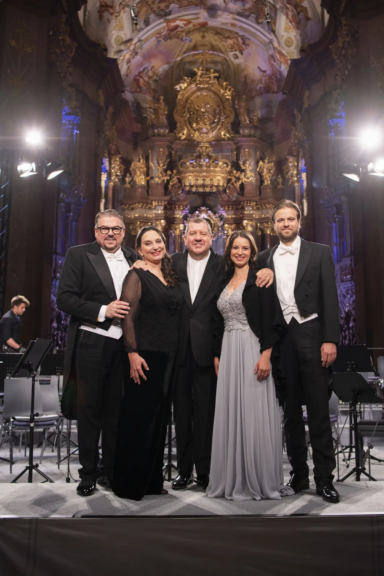 The soloists with the conductor in front of the high altar of the abbey church of Melk